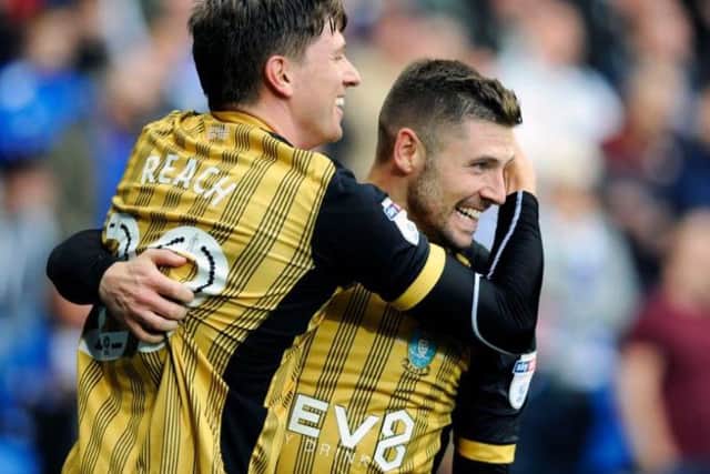 Adam Reach and Gary Hooper celebrate after Sheffield Wednesday take the lead at Cardiff City