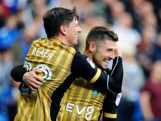 Adam Reach and Gary Hooper celebrate after Sheffield Wednesday take the lead at Cardiff City