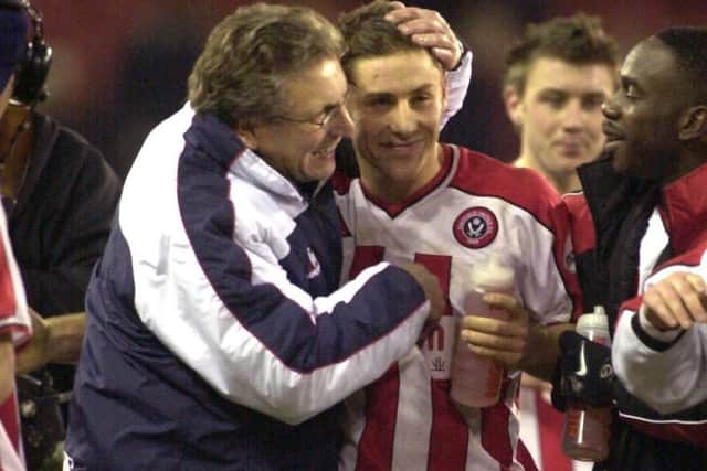 Blades hero Michael Brown at full-time with manager Neil Warnock after beating Wednesday