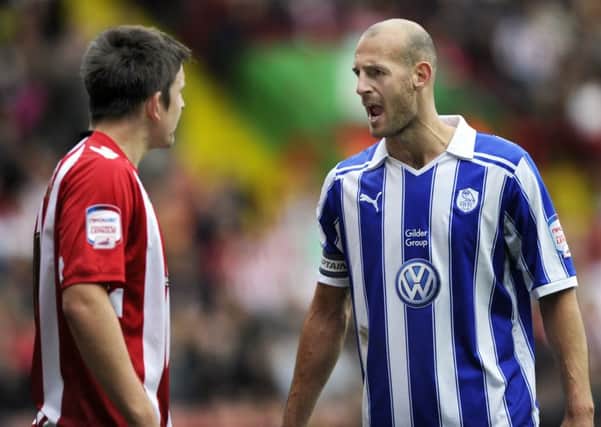 Rob Jones has an angry confrontation with Harry Maguire during the last Steel City Derby