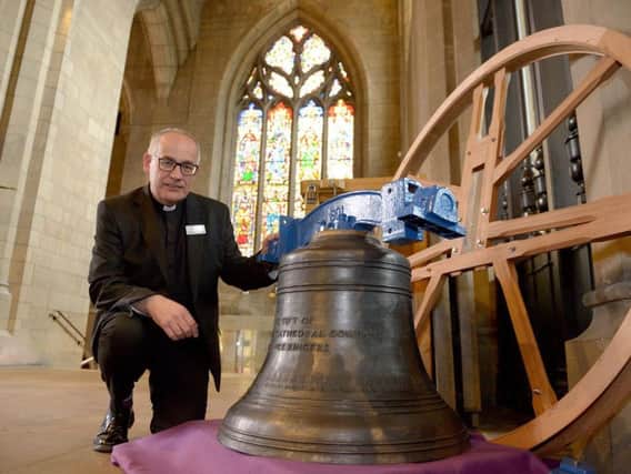Rev Keith Farrow with the new Sheffield Cathedral bell. Picture: Marisa Cashill