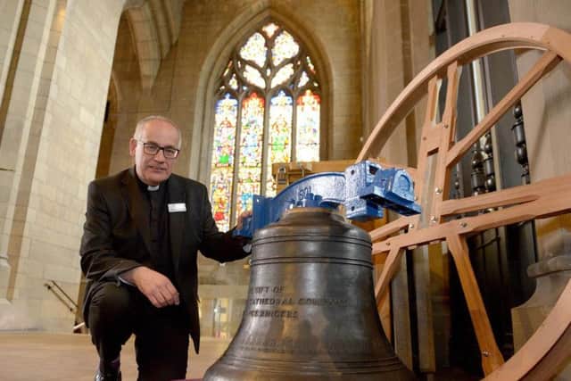 Rev Keith Farrow with the new Sheffield Cathedral bell. Picture: Marisa Cashill