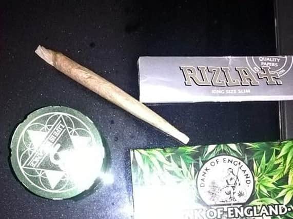 Police tweeted this photo of a spliff and other items they said were found in the vehicle