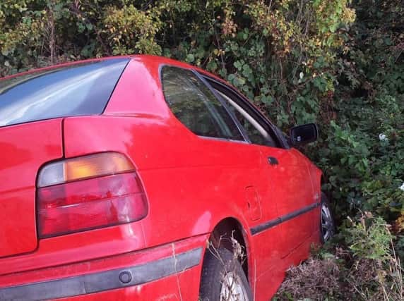 The occupants fled after this BMW crashed into a ditch in South Yorkshire