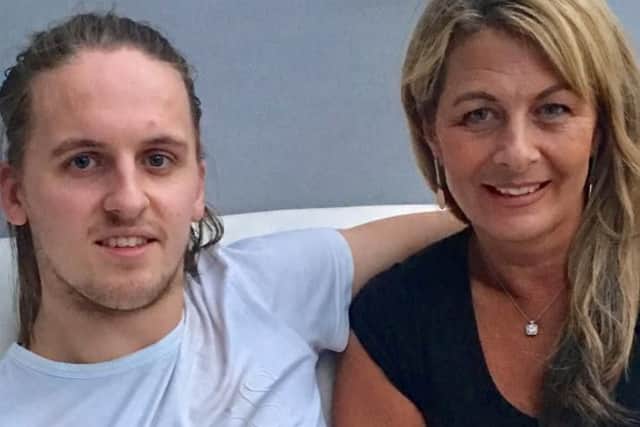 Scott is back at university following his 18 month recovery. he is pictured here with his mum Kate.