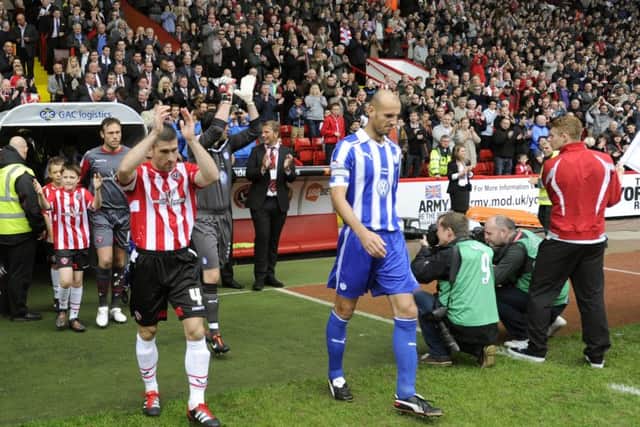 Rob Jones leads Wednesday out for the derby at Bramall Lane during the 2011/12 season