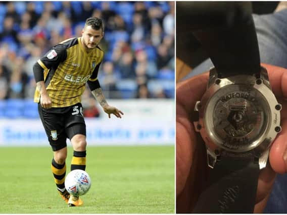 Daniel Pudil and an example of the commemorative watch which was stolen from his home in Sheffield