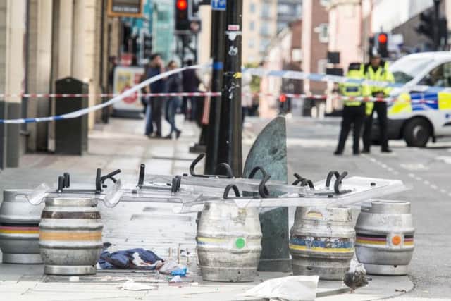 An area covered with beer barrels and what appear to be riot shields.