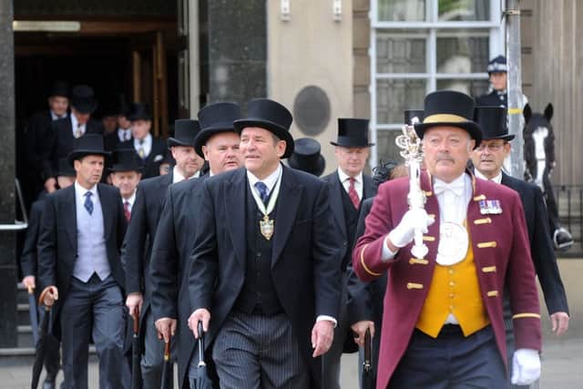 Sheffield's new Master Cutler  Ken Cooke (front middle) leads the prosession from the Cutlers' Hall to the Cathedral. Picture Scott Merrylees