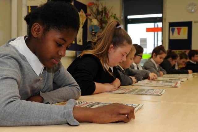 Arbourthorne Primary School pupils reading The Star. Picture by Andrew Roe