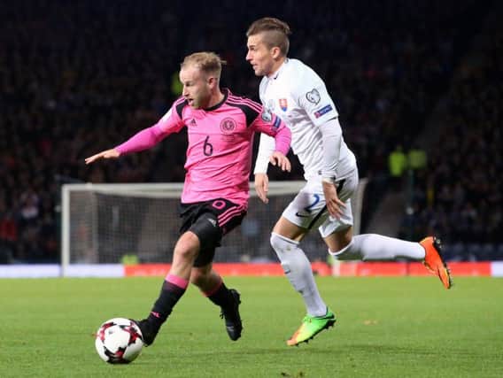 Scotland's Barry Bannan (left) and Slovakia's Peter Pekarik battle for the ball during the 2018 FIFA World Cup Qualifying, Group F match at Hampden Park, Glasgow. PRESS ASSOCIATION Photo.