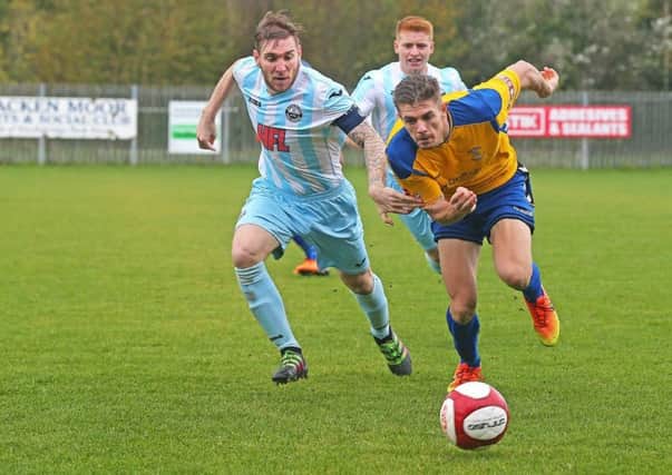 Stocksbridge striker Joe Lumsden tries to find a way through the Atherton defence. Photo Ian Revett