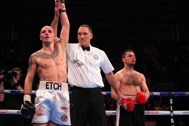 Adam Etches celebrates victory over Zoltan Sera at Sheffield Arena.