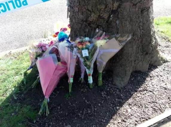 Floral tributes left to Jordan Hill near to his home in Southey Avene