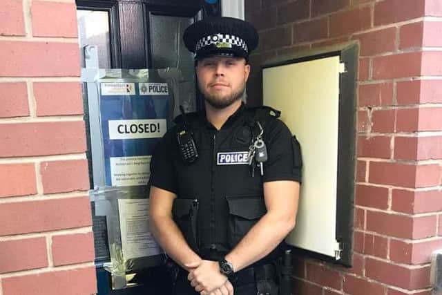 PC Lee Smith outside the Rotherham flat closed by police due to antisocial behaviour complaints
