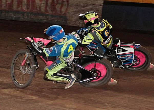 Josh Bates races inside Leicester's Cameron Heeps. Pic Andy Garner