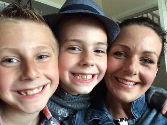 Katie with her sons Dylan and Alfie