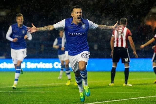 Ross Wallace celebrates after scoring against Brentford