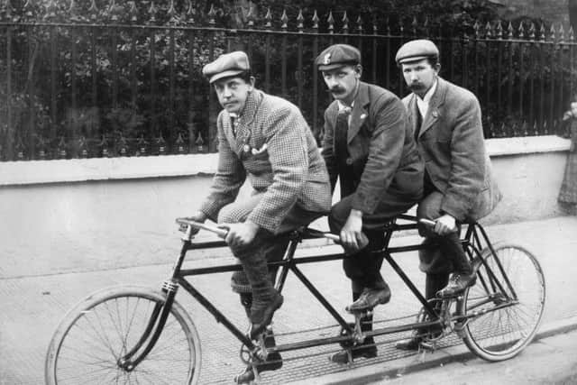 Three members of Sharrow Cycling Club on a 'Triple', c1890