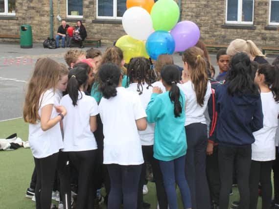 Hunter's Bar kids prepare to release balloons in memory of Sahra Daud