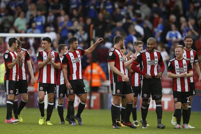 The players enjoy their walk to appreciate the fans after the Blades' win over Ipswich. Simon Bellis/Sportimage