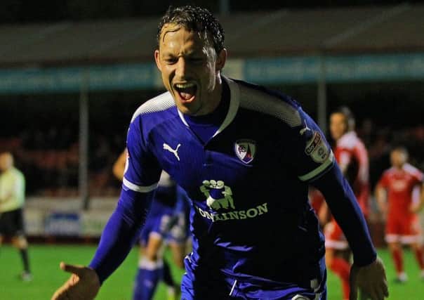 Kristian Dennis celebrates his opener for Chesterfield at Crawley. Picture by Gareth Williams/AHPIX.com;