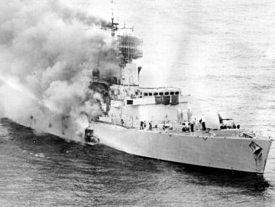 The HMS Sheffield ablaze after being hit by a missile during the Falklands War