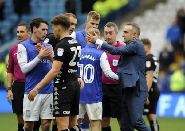 Carlos Carvalhal congratulating his players after their win over Leeds United