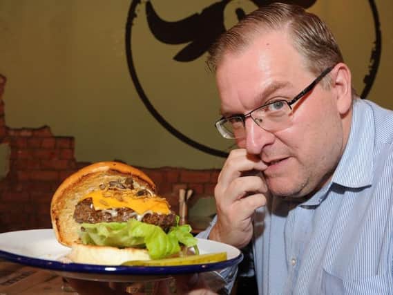 Darren Burke prepares to do battle with the Crispy Critter burger. (Photo: Andrew Roe)