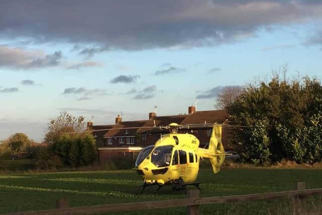 The air ambulance in a field by the A638 Great North Road.