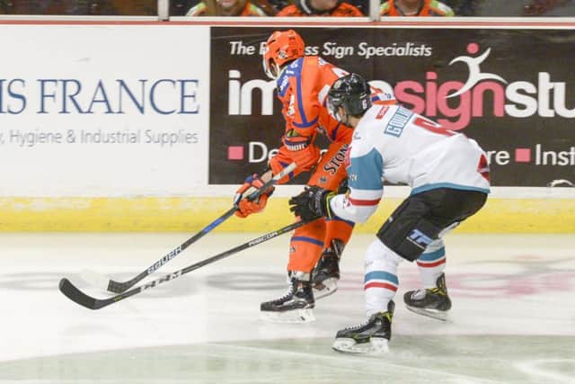Sheffield Steelers v Belfast Giants
Steelers John Armstrong is hassled on the boards