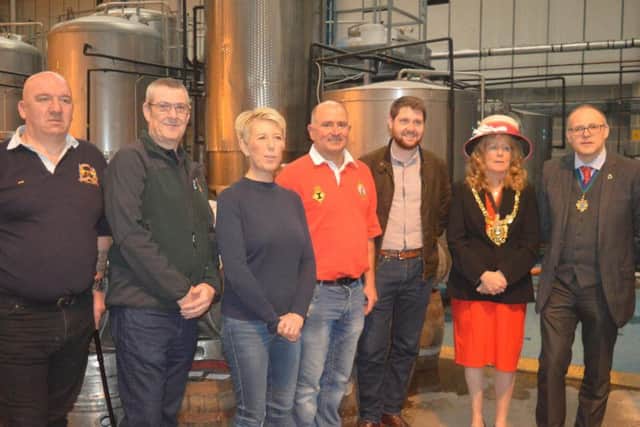 Sheffield lord mayor Anne Murphy (second from right) and MP Angela Smith (third from left) joined Armed Forces Day organisers and brewery workers for the cheque handover