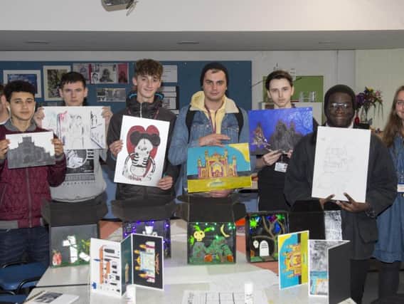 Some of the students at Longley Park Sixth Form College and their works of art