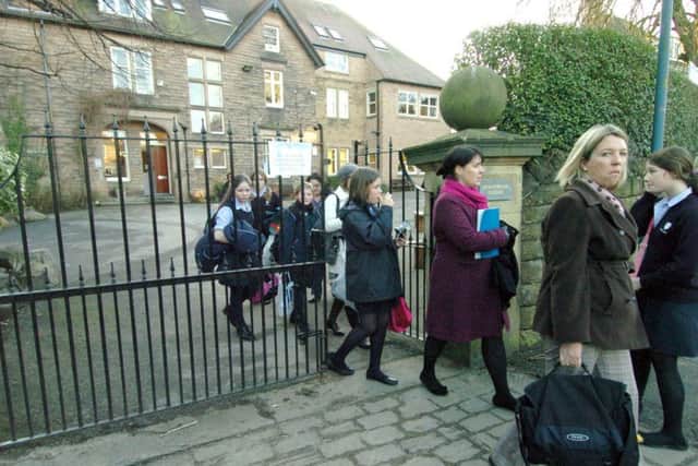 Parents and pupils leave Brantwood School at the end of the school day in February 2010
