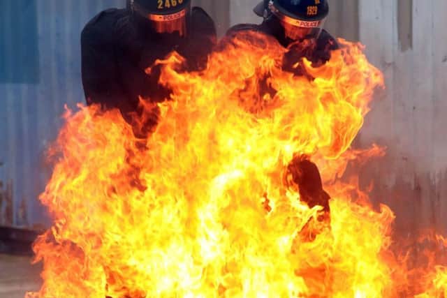 Officers face the flames.