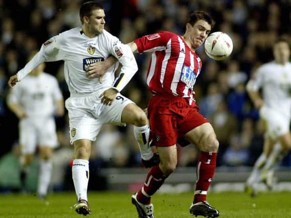 Chris Morgan holds off Leeds United's David Healy at Elland Road in April, 2005 when the Blades last beat their Yorkshire rivals away from home