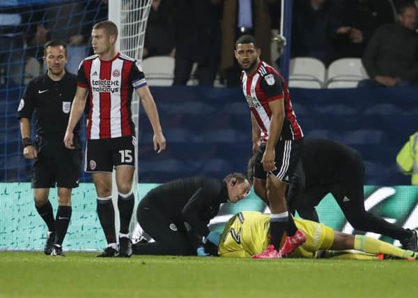 Jamal Blackman of Sheffield Utd receives treatment at QPR. Pic: David Klein/Sportimage