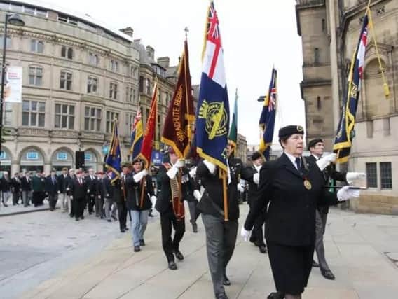 Veterans stride out for Armed Forces Day in Sheffield city centre.