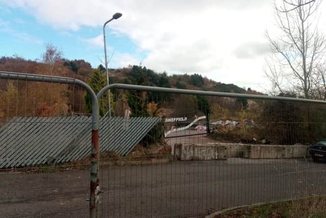 The entrance to the abandoned former Ski Village can be seen from the edge of the travellers site