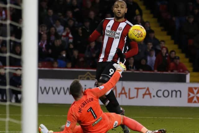 TOP MAN: Leon Clarke lifts the ball over Hull City goalkeeper Allan McGregor to score the second goal at Bramall Lane. Picture: Simon Bellis/Sportimage