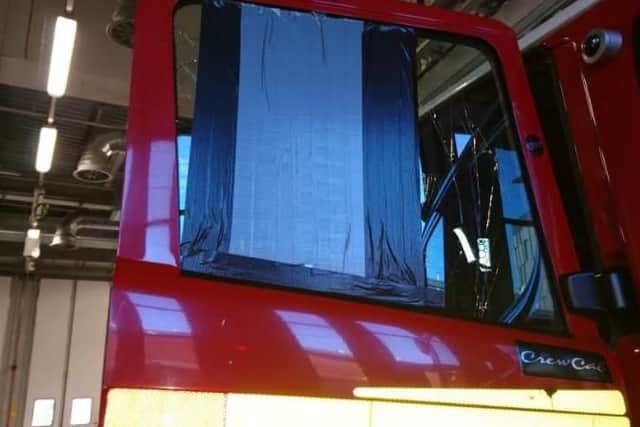 The damaged window.