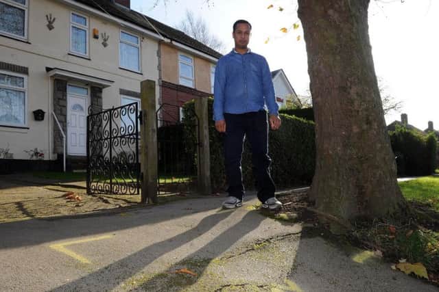 Islam Uddin wants the council to cut down a tree he says is damaging the pavement outside his parents' house.