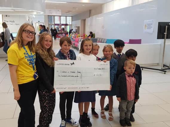 Lucy Davies, from The Children's Hospital Charity with Hannah and Lucy Mills, Ruby Fowler, Annabel and Evie Smith, Arjan and Amar Singh and Milo Fowler