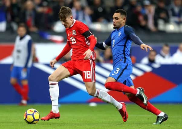 Wales' David Brooks (left) and France's Layvin Kurzawa battle for the ball
