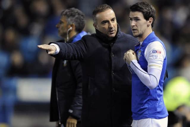 Owls Carlos Carvalhal gives last minute instructions to sub Kieran Lee before coming on against Millwall...Pic Steve Ellis