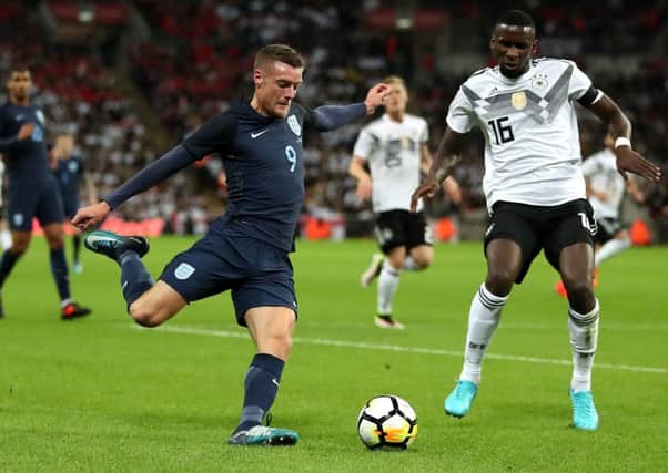 England's Jamie Vardy (left) and Germany's Antonio Rudiger (right) battle for the ball.