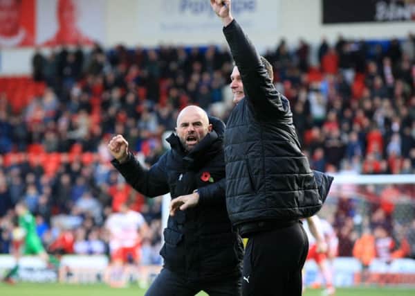 Paul Warne, his new coat and Mike Pollitt celebrate the equaliser. Pictures: Chris Etchells