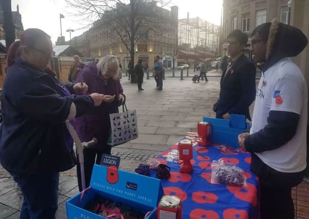 Members of the Ahmadiyya Muslim Youth Association selling poppies in South Yorkshire