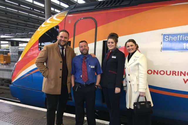 Christian and Claire with staff from East Midlands Trains, which helped him plan the proposal (@OliConstable/BBC)