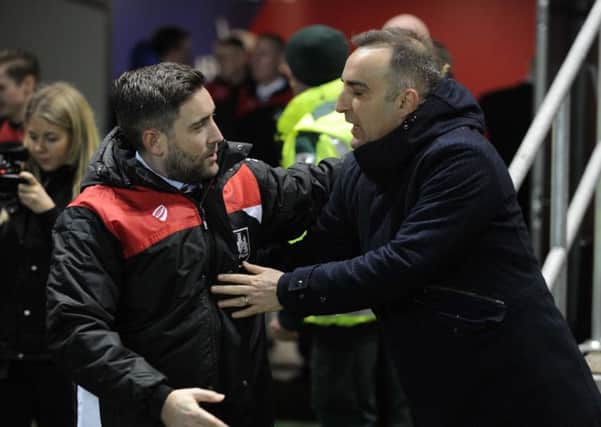 Rival bosses Owls' Carlos Carvalhal with City's Lee Johnson